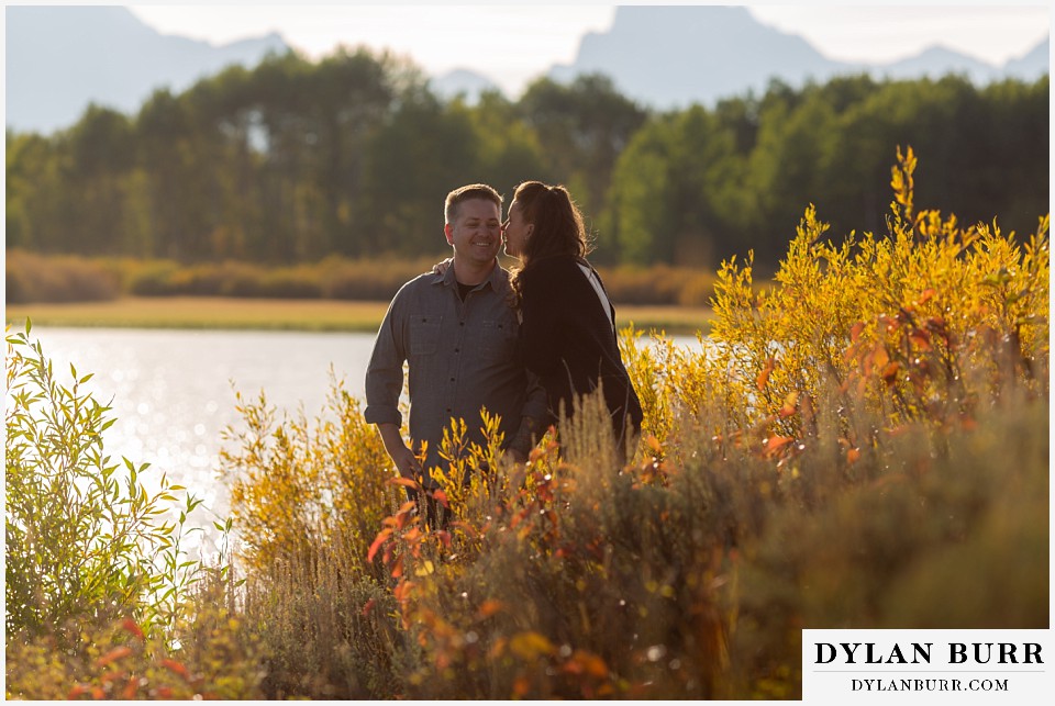 grand teton wedding anniversary photos she goes in for a cheek kiss