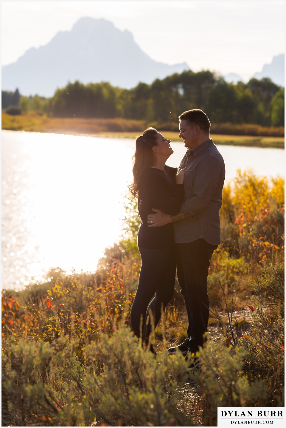 grand teton wedding anniversary photos getting in close and laughing together