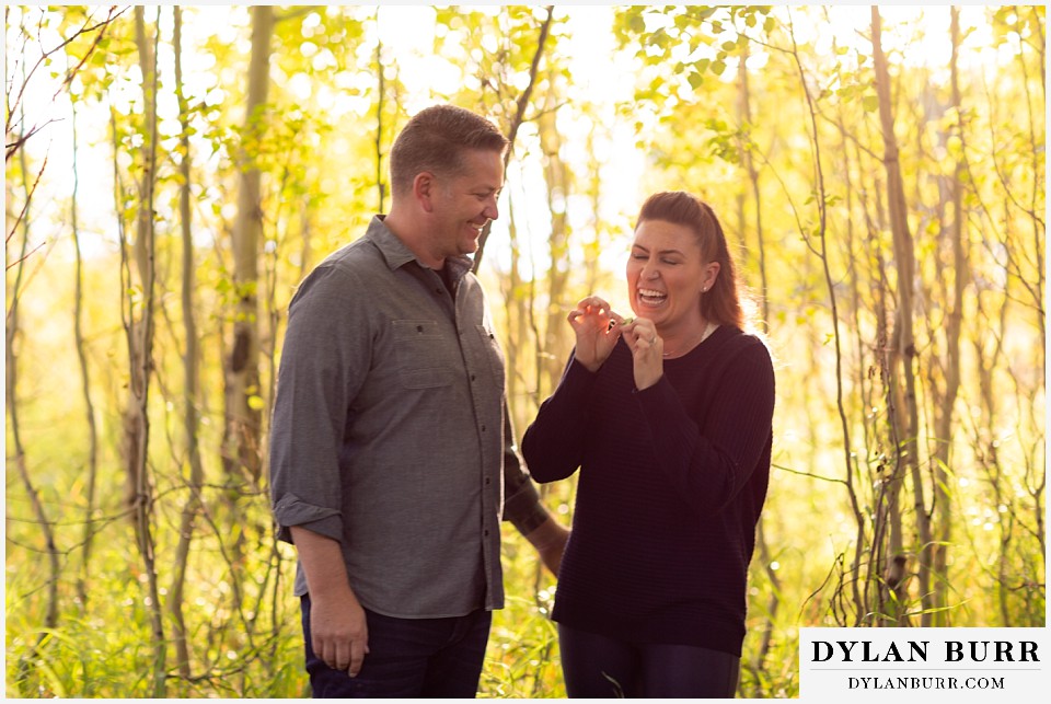 grand teton wedding anniversary photos couple laughing together in aspen trees