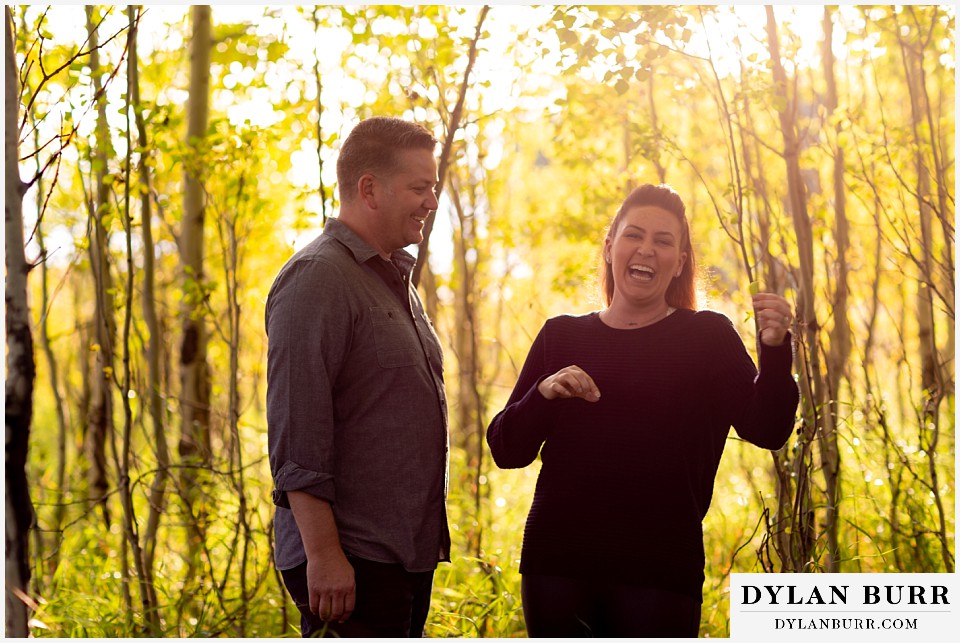 grand teton wedding anniversary photos couple in aspen trees laughing