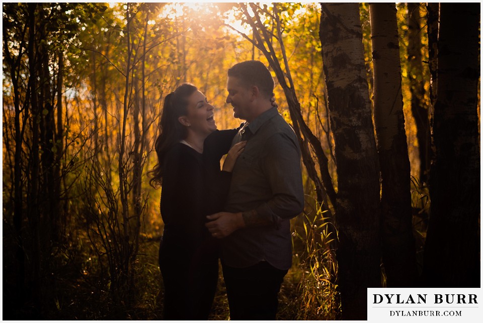 grand teton wedding anniversary photos bride laughing in golden aspen trees