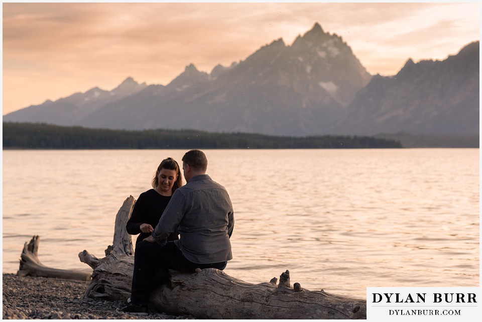 grand teton wedding anniversary photos couple playing together with grand teton in the distance