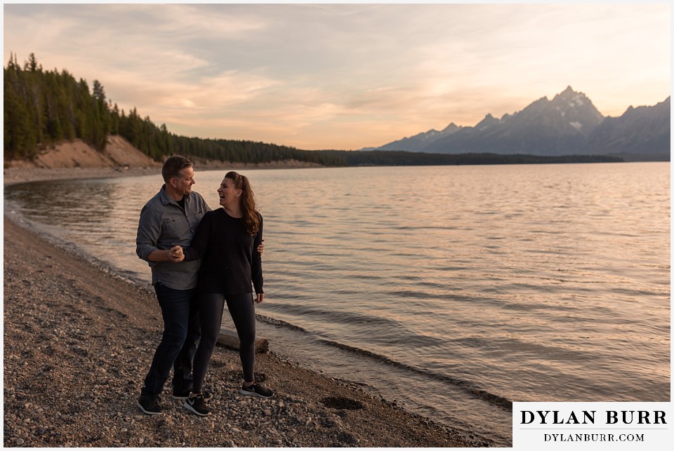 grand teton wedding anniversary photos couple together holding hands at jackson lake