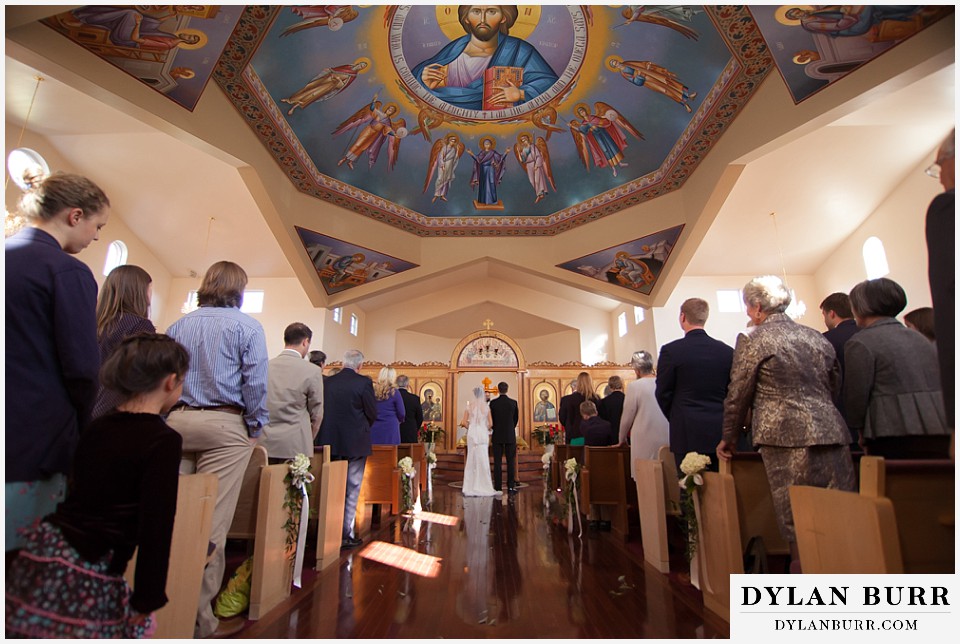 greek orthodox wedding wide view of bride and groom during wedding ceremony