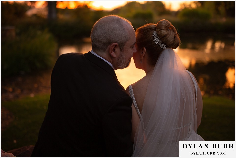 hudson gardens wedding bride and groom sharing a moment by the pond at sunset