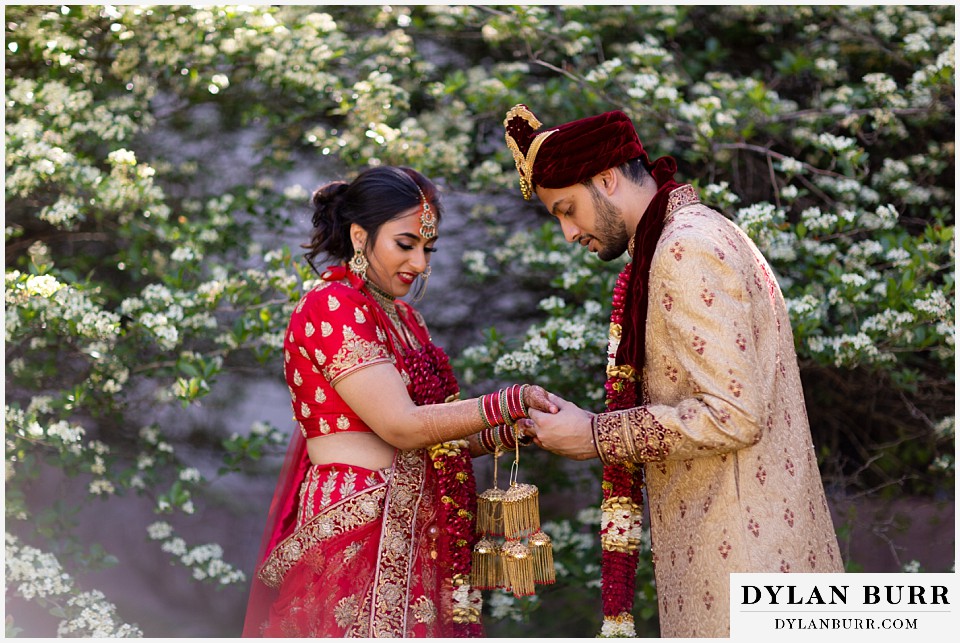 hyatt regency tech center hindu wedding groom trying to find name in henna art