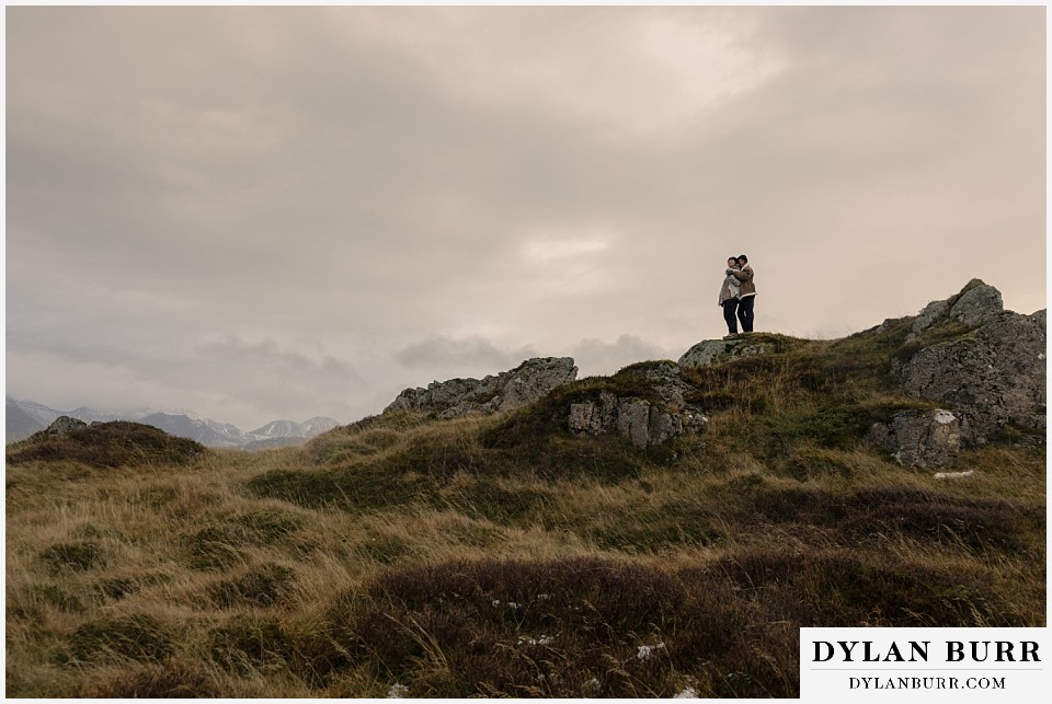 lgtbq couples hot springs session in Iceland on top of mountain ridge