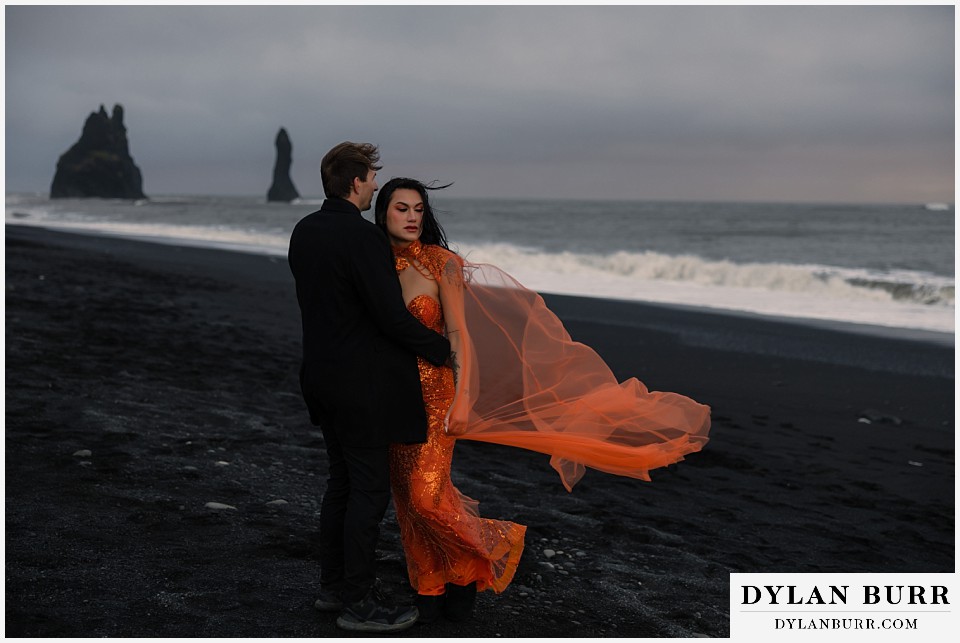 iceland elopement at reynisfjara beach bride in orange dress