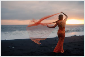iceland elopement at reynisfjara beach orange dress