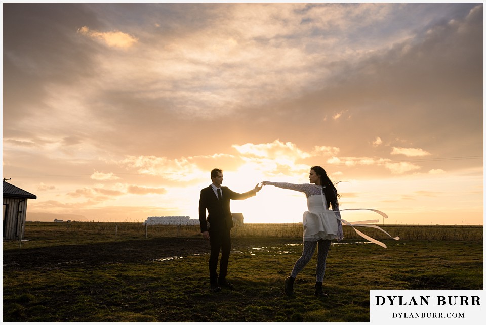 iceland elopement near selfoss with icelandic horses couple dancing in the sunrise light