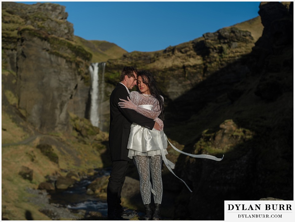 Iceland elopement wedding waterfall canyon near selfoss couple holding each other