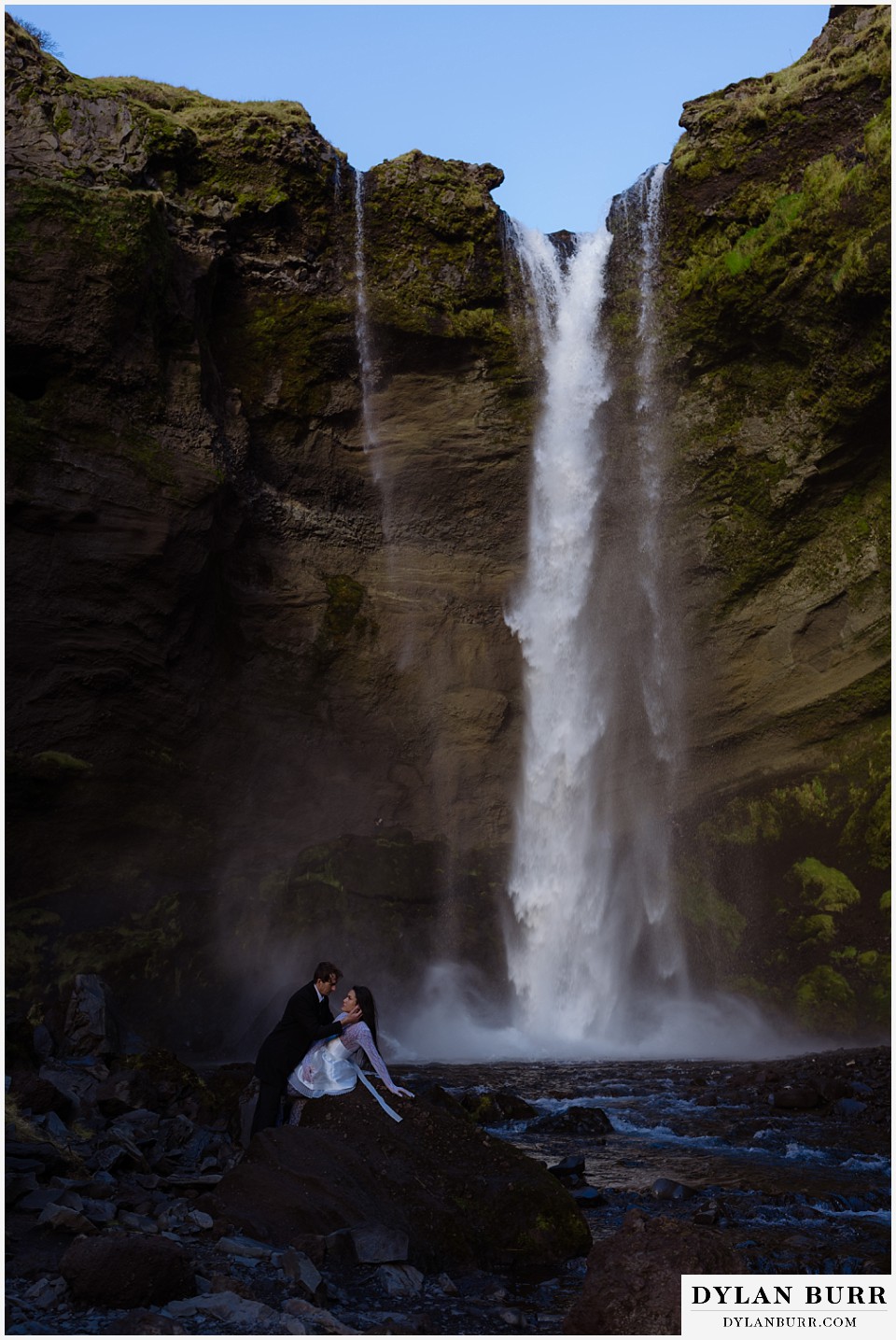 Iceland elopement wedding waterfall canyon near selfoss giant tall waterfall with couple
