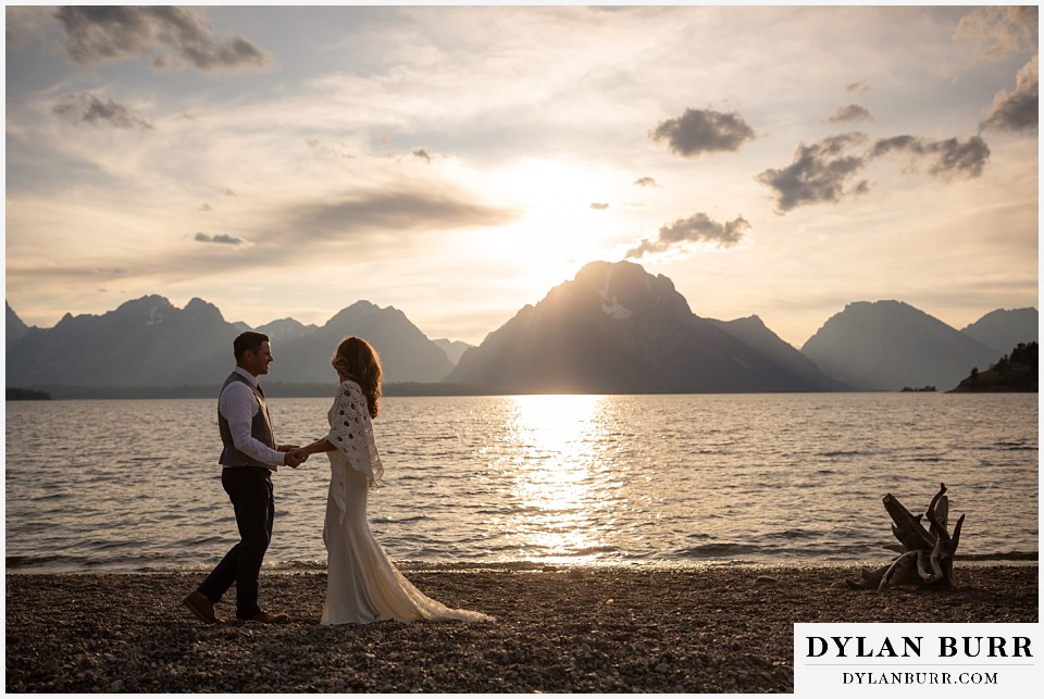 jackson lake lodge wedding grand tetons wyoming bride and groom together down at the lakeside