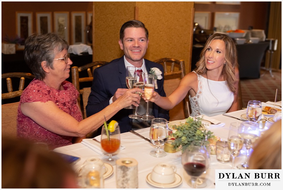 jackson lake lodge wedding grand tetons wyoming bride and groom toasting mother of bride