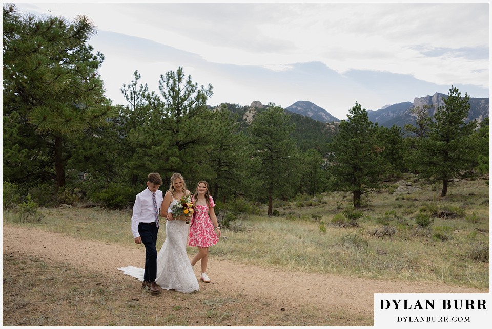 knoll willows open space elopement wedding bride coming down aisle with her children