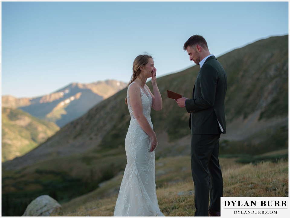 sunrise elopement wedding emotional bride during grooms vows