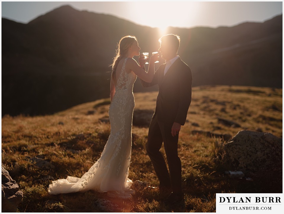 sunrise elopement wedding champagne toast at sunrise