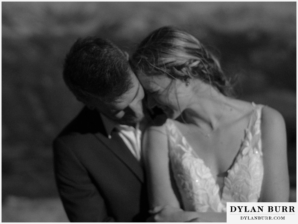 sunrise elopement wedding bride and groom snuggling black and white