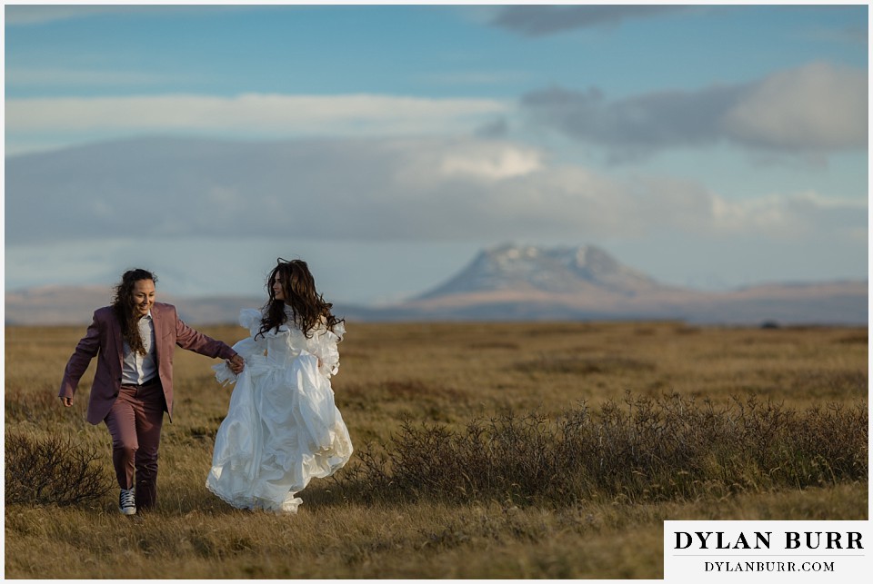 lgtbq iceland elopement wedding rural iceland running with mountains in background