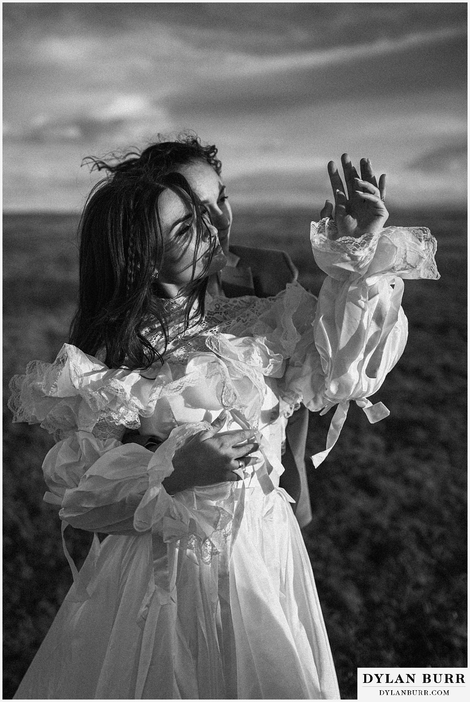 lgtbq iceland elopement wedding brides at sunrise looking at rings