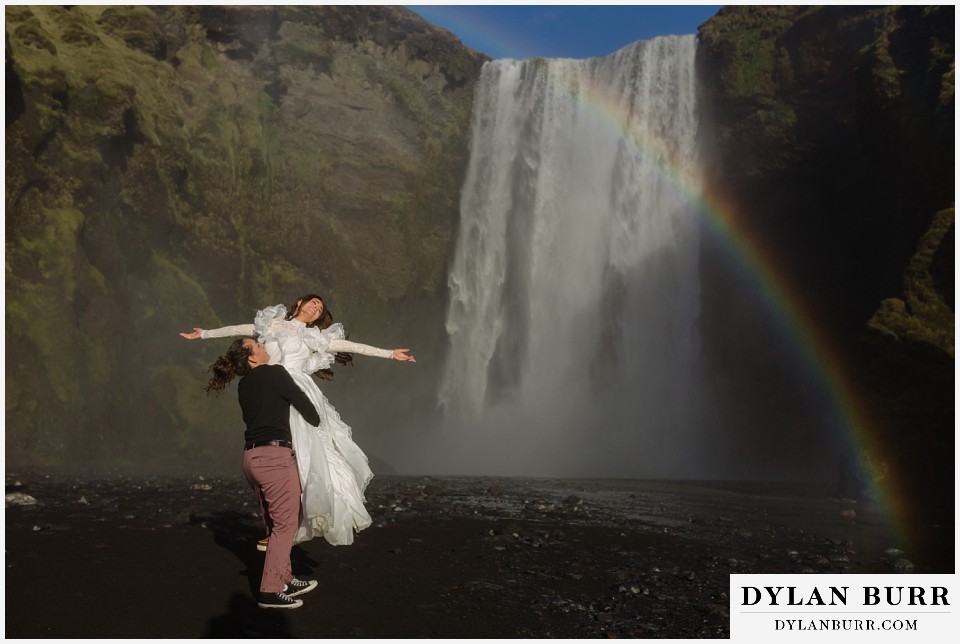 lgtbq iceland elopement wedding celebrating in the mist of skogfoss with a rainbow