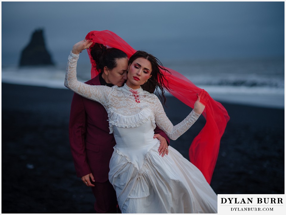 lgtbq iceland elopement wedding Reynisfjara beach black sand beach with red veil