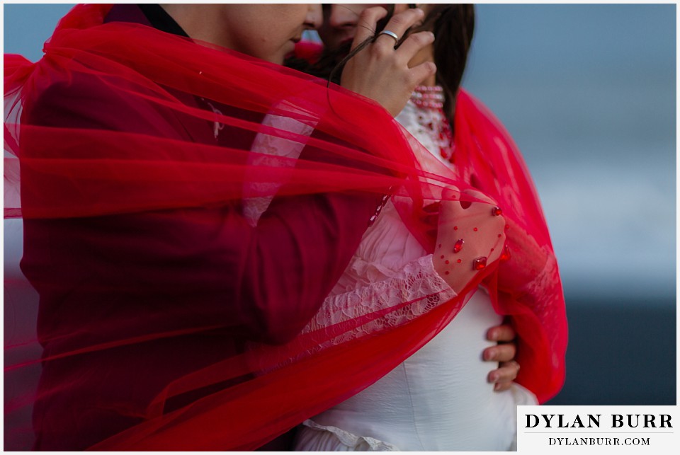 lgtbq iceland elopement wedding Reynisfjara beach close up red details