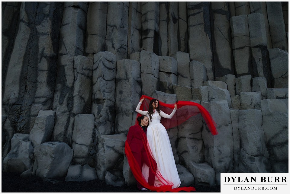 lgtbq iceland elopement wedding Reynisfjara beach basalt brides with red veil