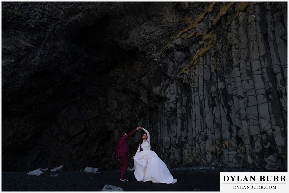 lgtbq iceland elopement wedding dancing outside Hálsanefshellir Cave