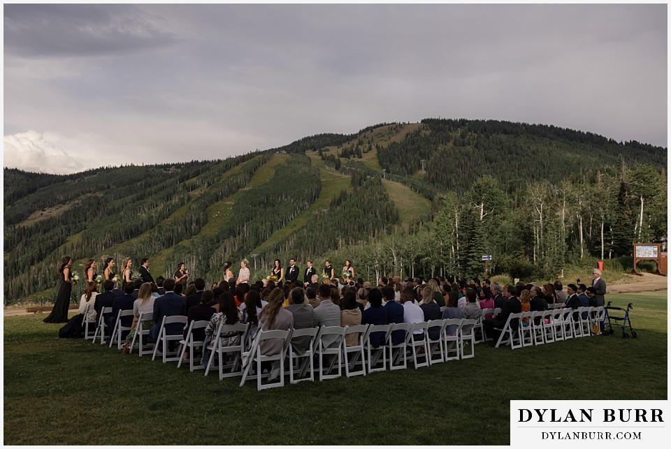 lgbtq wedding thunderhead lodge steamboat wedding wide view of ski resort wedding ceremony on lawn