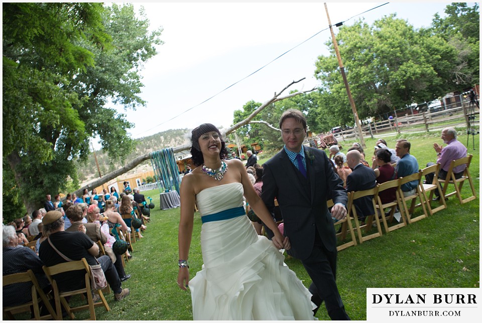 lyons farmette wedding walking out of ceremony together