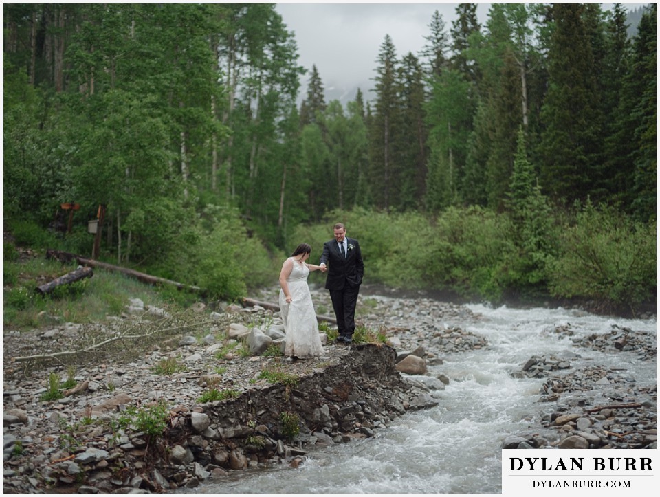 marble colorado elopement wedding walking together near river
