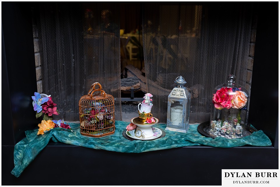 maroon bells wedding aspen colorado mountain wedding alice in wonderland theme birdcage and details in fireplace