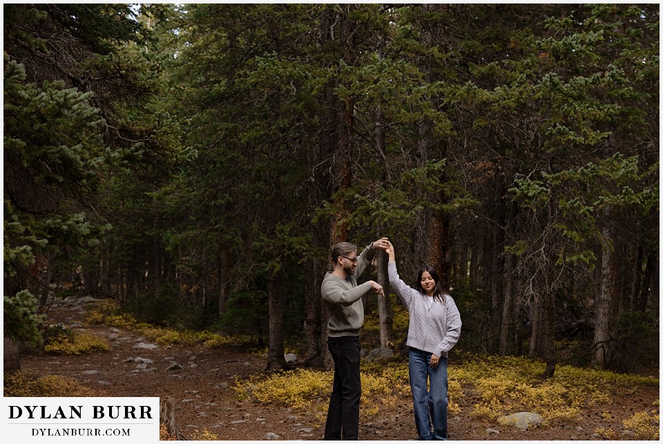 marriage proposal at brainard lake recreation area dancing in trees