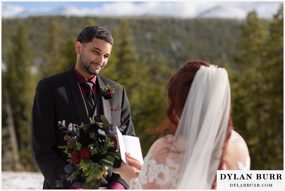 groom looking at his wife with so much love and adoration