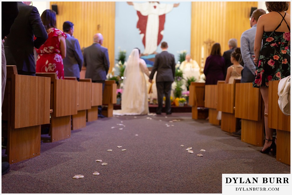 mother cabrini shrine wedding golden colorado flower petals in aisle
