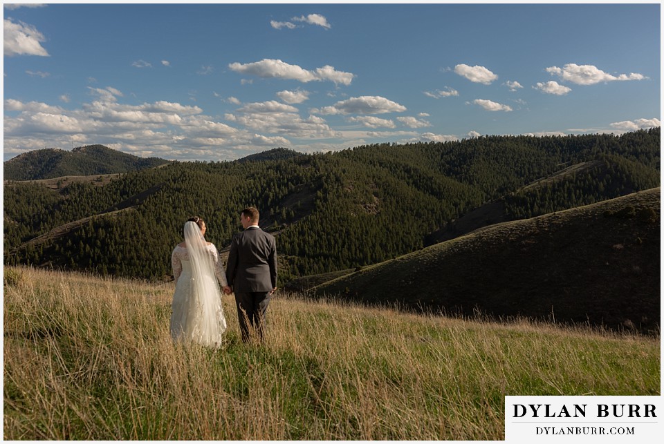 mother cabrini shrine wedding golden colorado bride and groom walking in the mountains