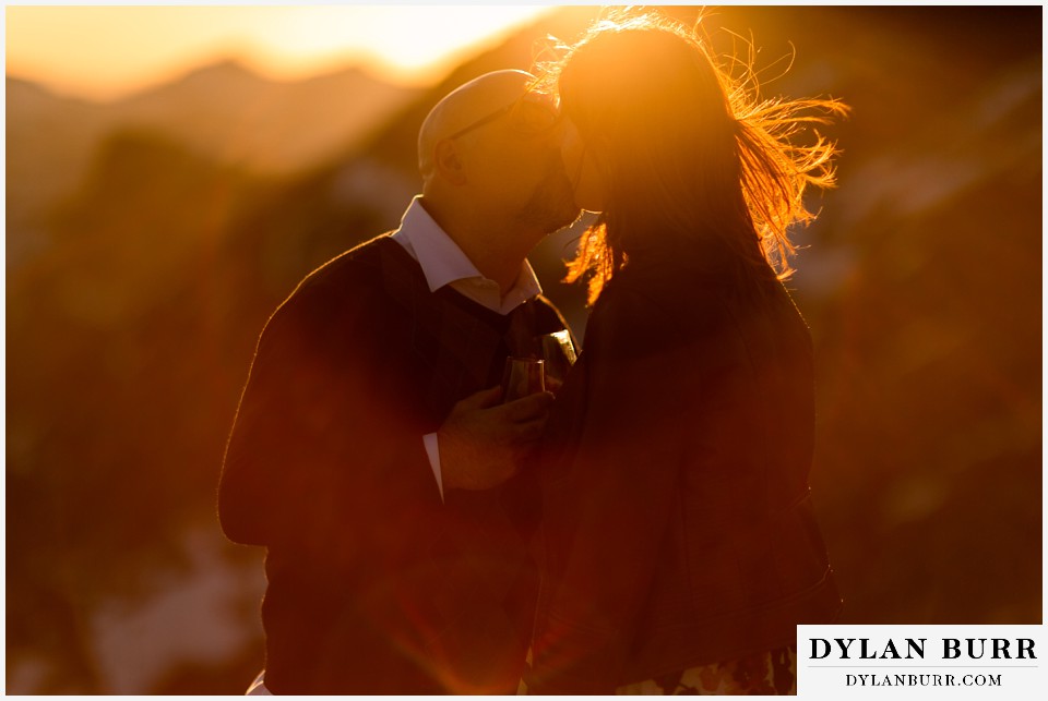 mountain sunset kiss during engagement photo session