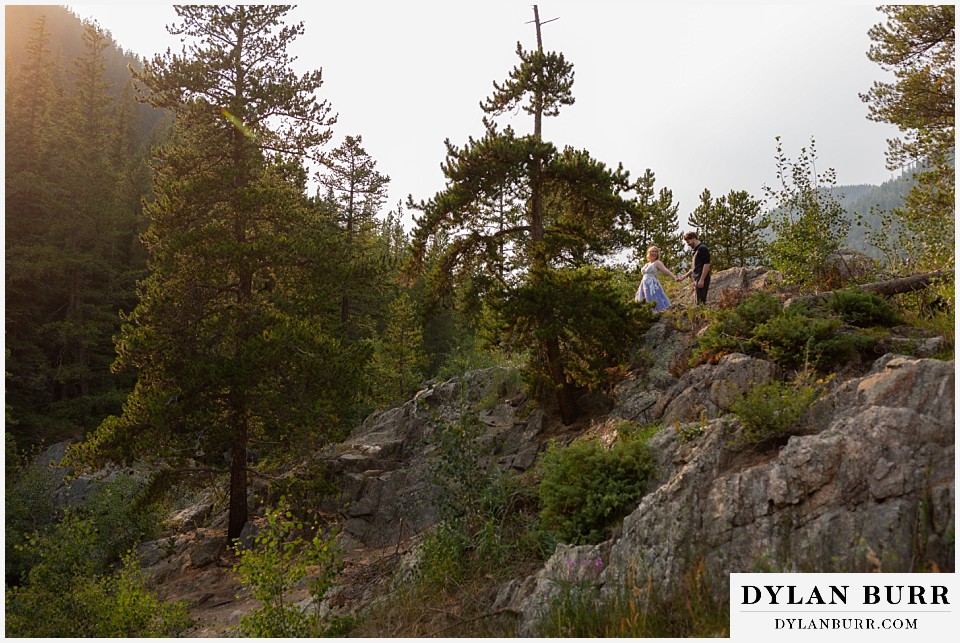 mountain adventure elopement wedding colorado bride and groom walking along ridge