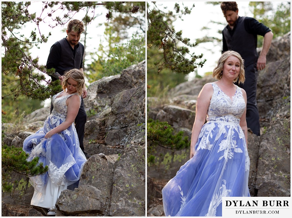 mountain adventure elopement wedding colorado bride and groom hiking down on large rocks