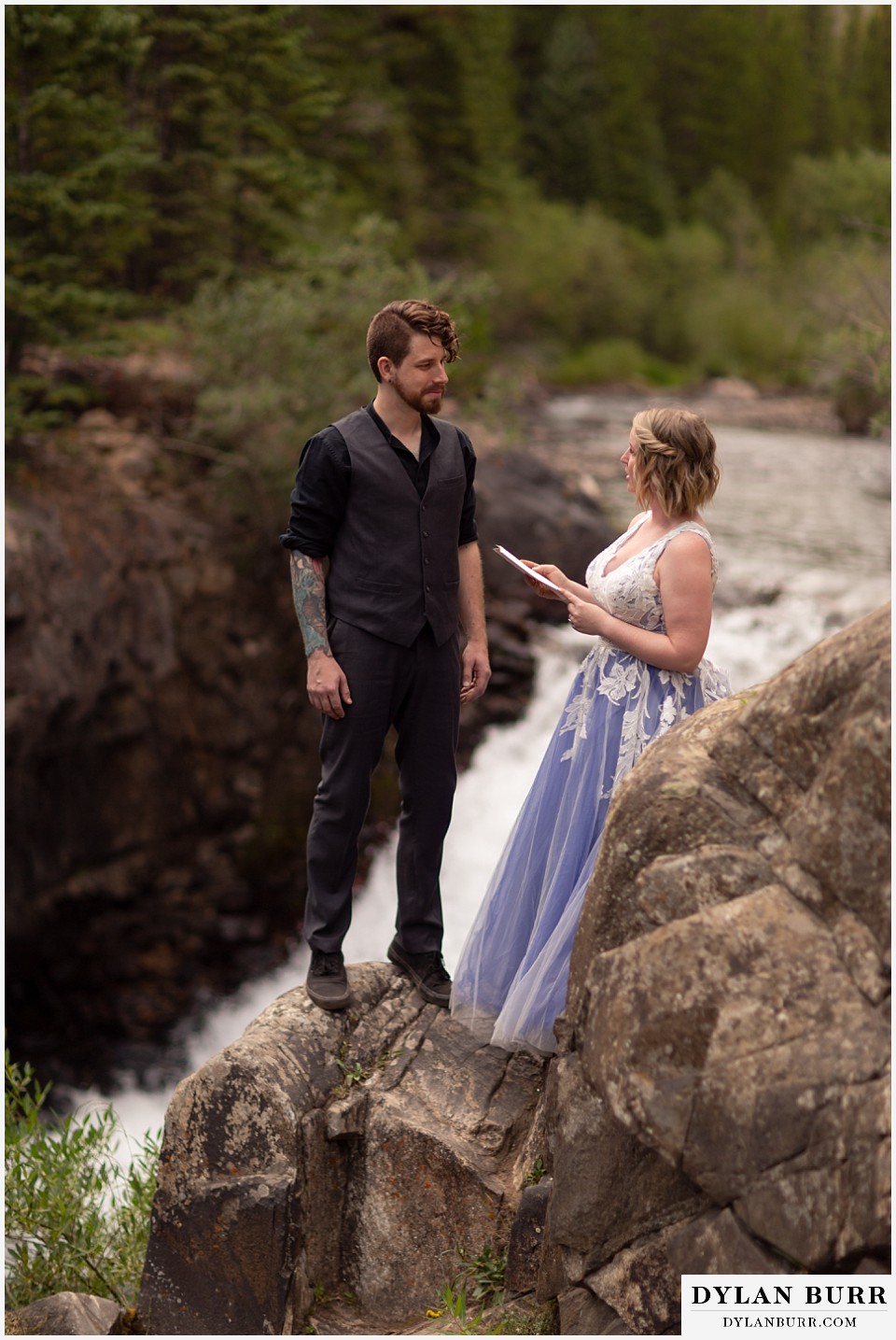 mountain adventure elopement wedding colorado bride reading vows to her husband