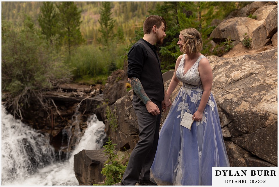 mountain adventure elopement wedding colorado bride and groom having a funny moment