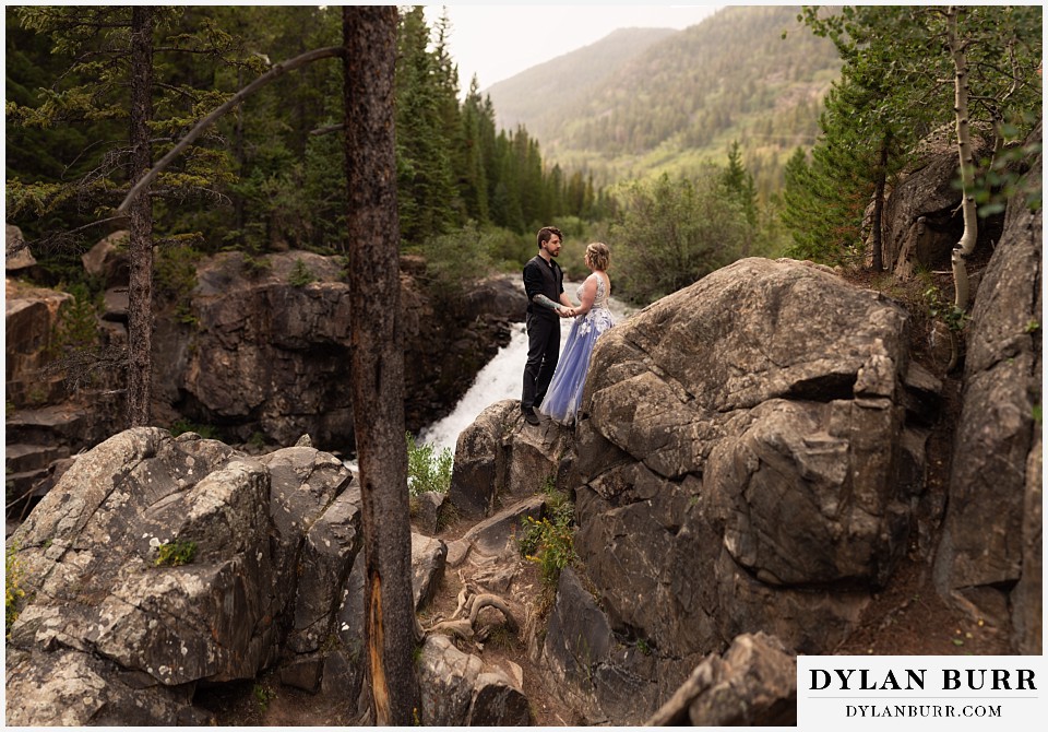 mountain adventure elopement wedding colorado pano portrait cliffside along river
