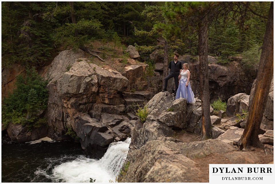 mountain adventure elopement wedding colorado bride and groom looking out over river