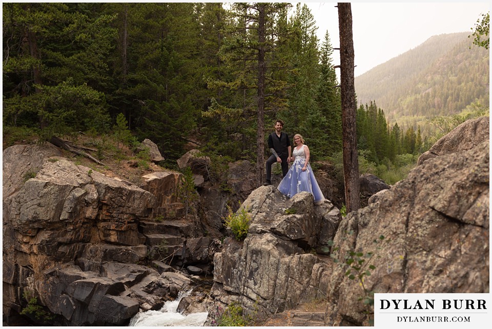 mountain adventure elopement wedding colorado newlyweds near cliff edge in mountains