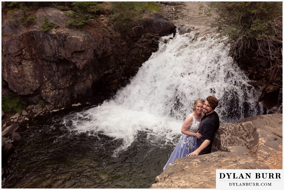 mountain adventure elopement wedding colorado top view of bride and groom near river