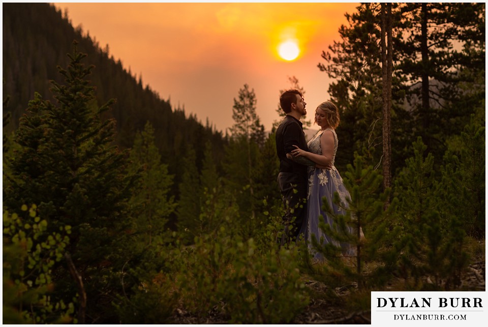 mountain adventure elopement wedding colorado large wildfires rage on at the sun sets.
