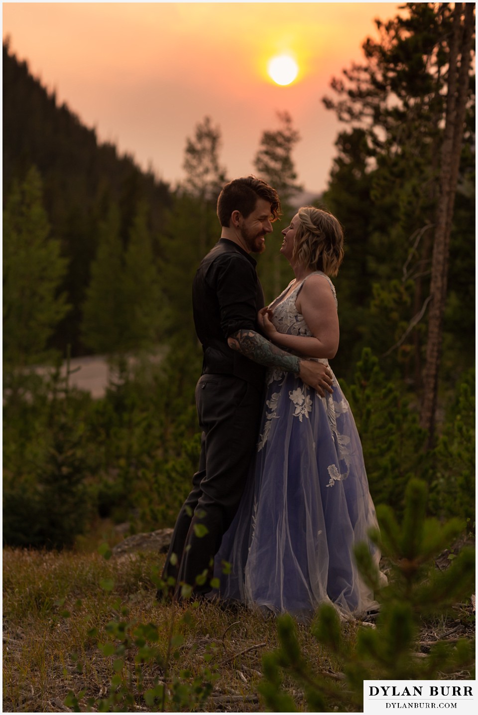 mountain adventure elopement wedding colorado bride and groom laughing at sunset