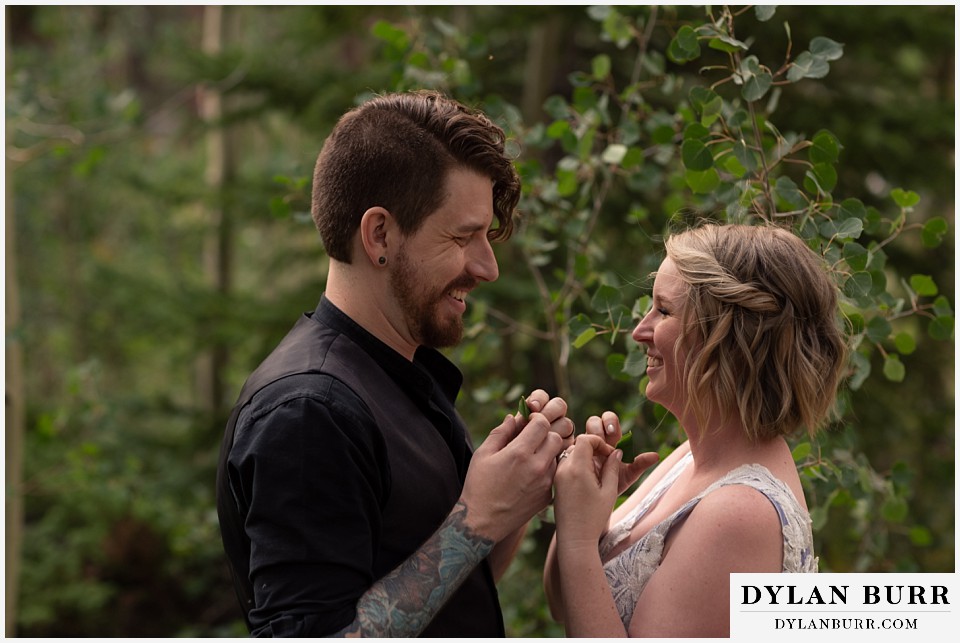 mountain adventure elopement wedding colorado laughing together in close in aspen trees