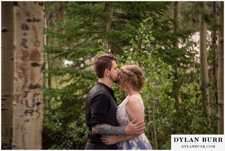 mountain adventure elopement wedding colorado groom kissing brides head